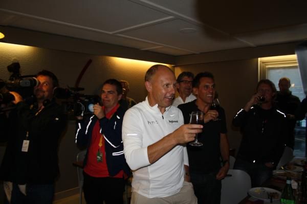 The team staff toast Cav's stage win