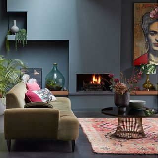 Modern grey living room ideas with dark grey walls and green sofa