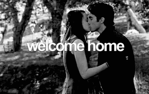 Characters Jess and Rory kiss. A subtitle reads, "Welcome home."