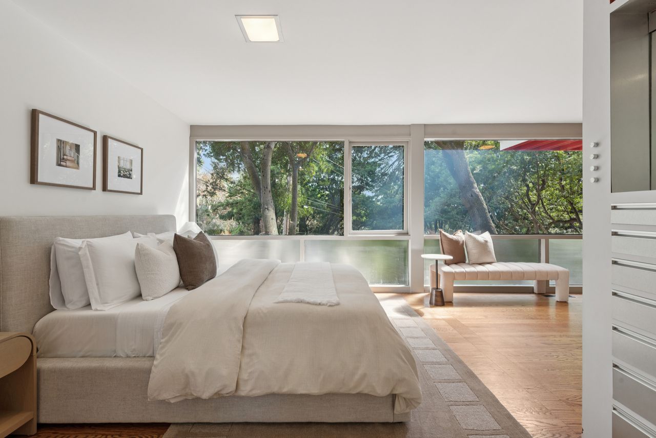 A bedroom and dressing area at the front of the house