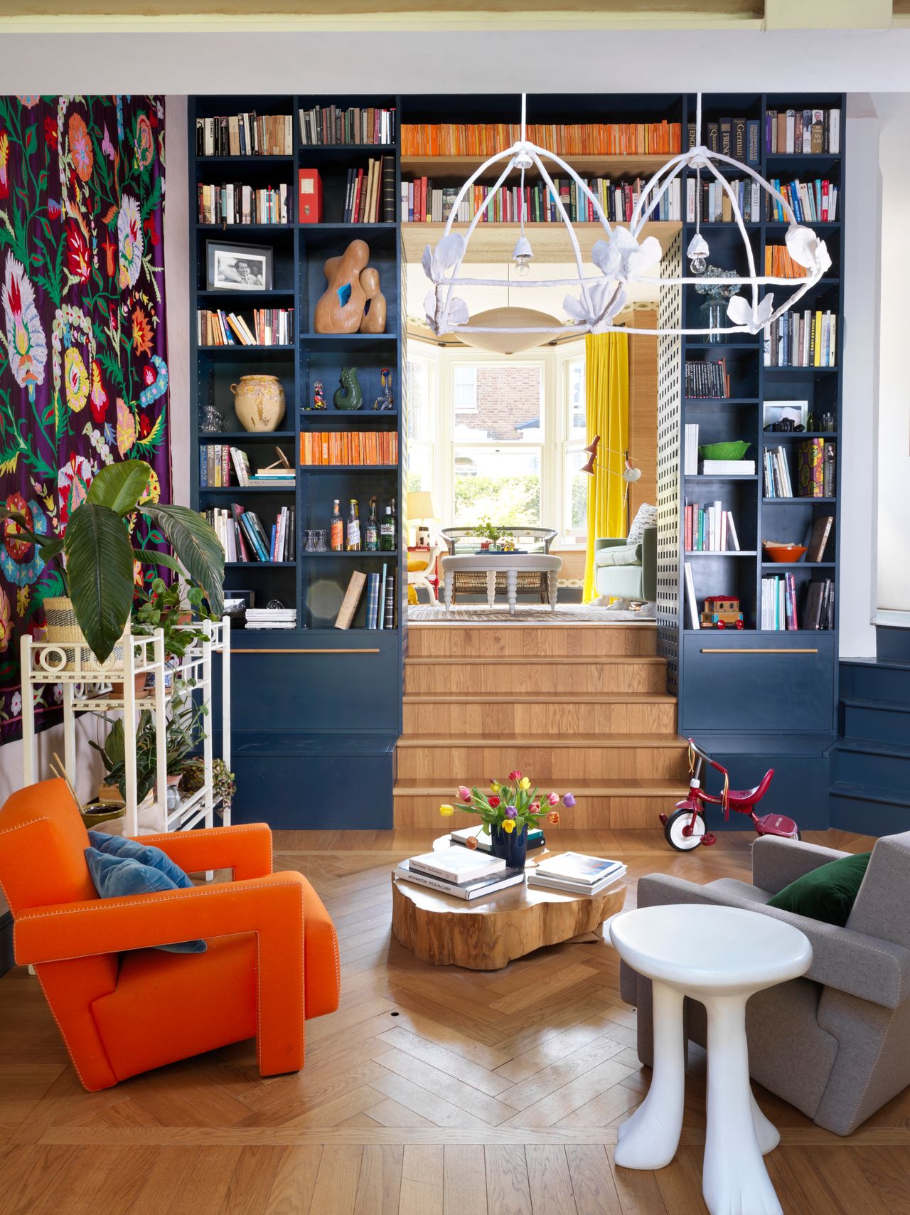 Living room/library to kitchen by Beata Heuman