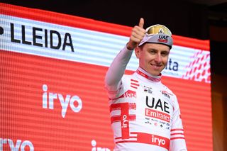 LLEIDA SPAIN MARCH 21 Tadej Pogacar of Slovenia and UAE Emirates Team Green Leader Jersey celebrates at podium as Red Mountain Jersey winner during the 103rd Volta Ciclista a Catalunya 2024 Stage 4 a 1692km stage from Sort to Lleida UCIWT on March 21 2024 in Lleida Spain Photo by David RamosGetty Images