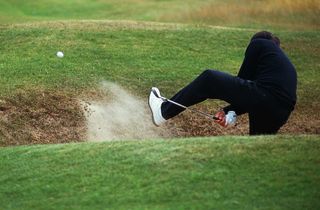 Seve Ballesteros playing from a bunker GettyImages-83776074