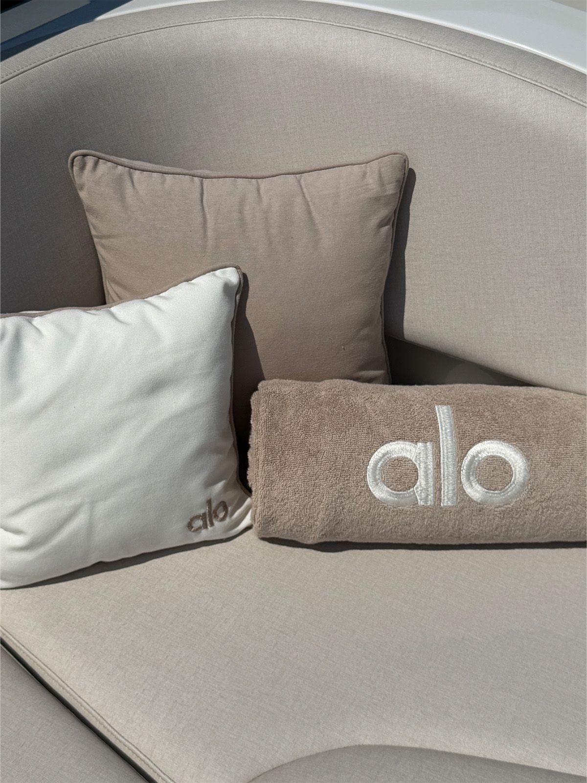 A photo of the Alo-branded pillows and towels on the tender to the boat.