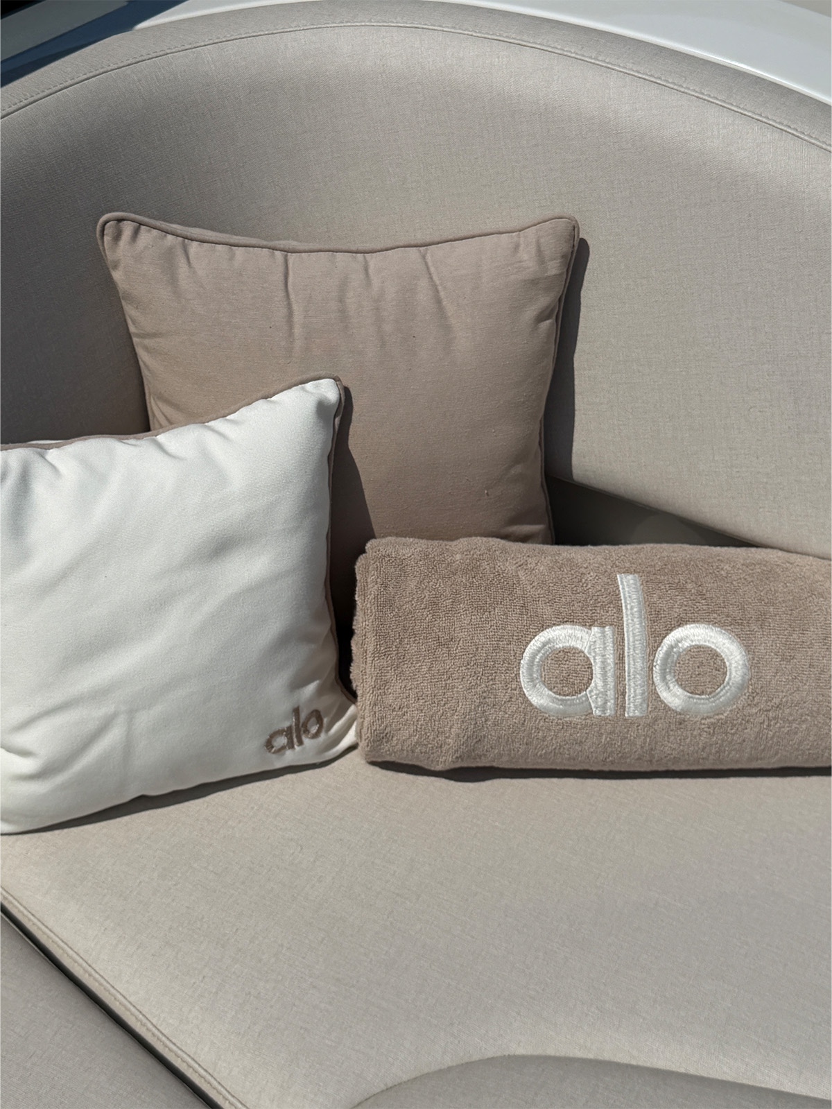 A photo of the Alo-branded pillows and towels on the tender to the boat.