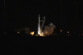 SpaceX's first Falcon 9 rocket launching toward the International Space Station ignites its nine main engines briefly in this NASA photo shortly before aborting the launch try on May 19, 2012 due to an unexpected engine sensor reading.
