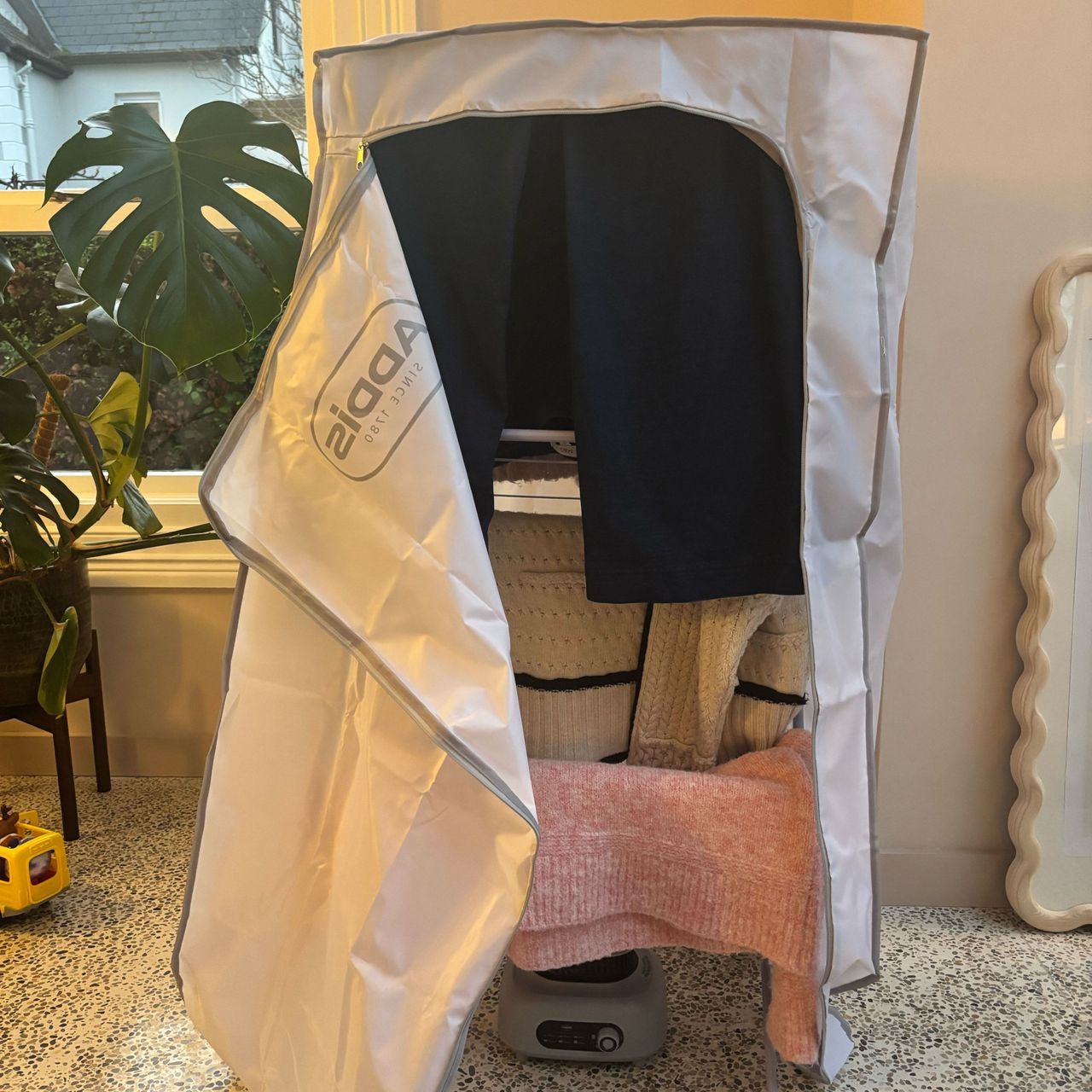 Addis heat pod and cover over an airer with clothes