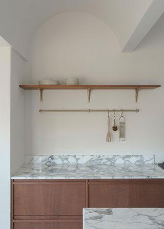 Kitchen with arched ceiling and simple open shelving