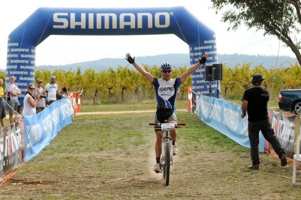 Ben Mather celebrates as he crosses the line first.