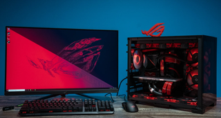 Asus ROG PC with monitor, keyboard, and mouse in red