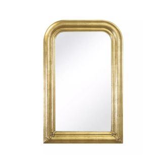 A rectangular brushed gold mirror with a curved top