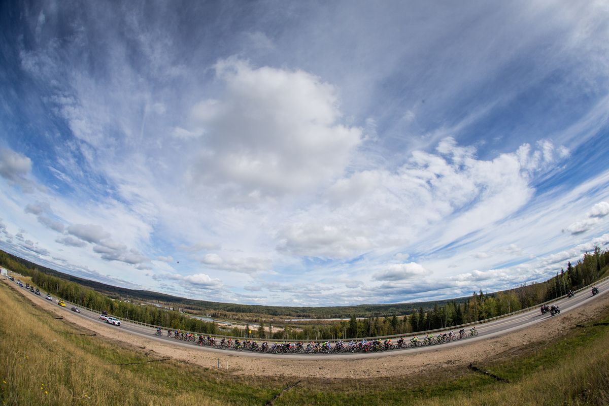 The peloton tackles stage 3's final climb under cloudy skies in Alberta