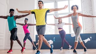 Group of people doing a Zumba workout in a dance studio