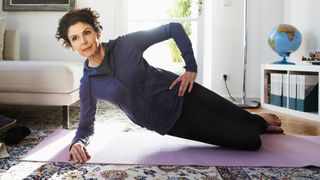 Woman exercising on yoga mat.
