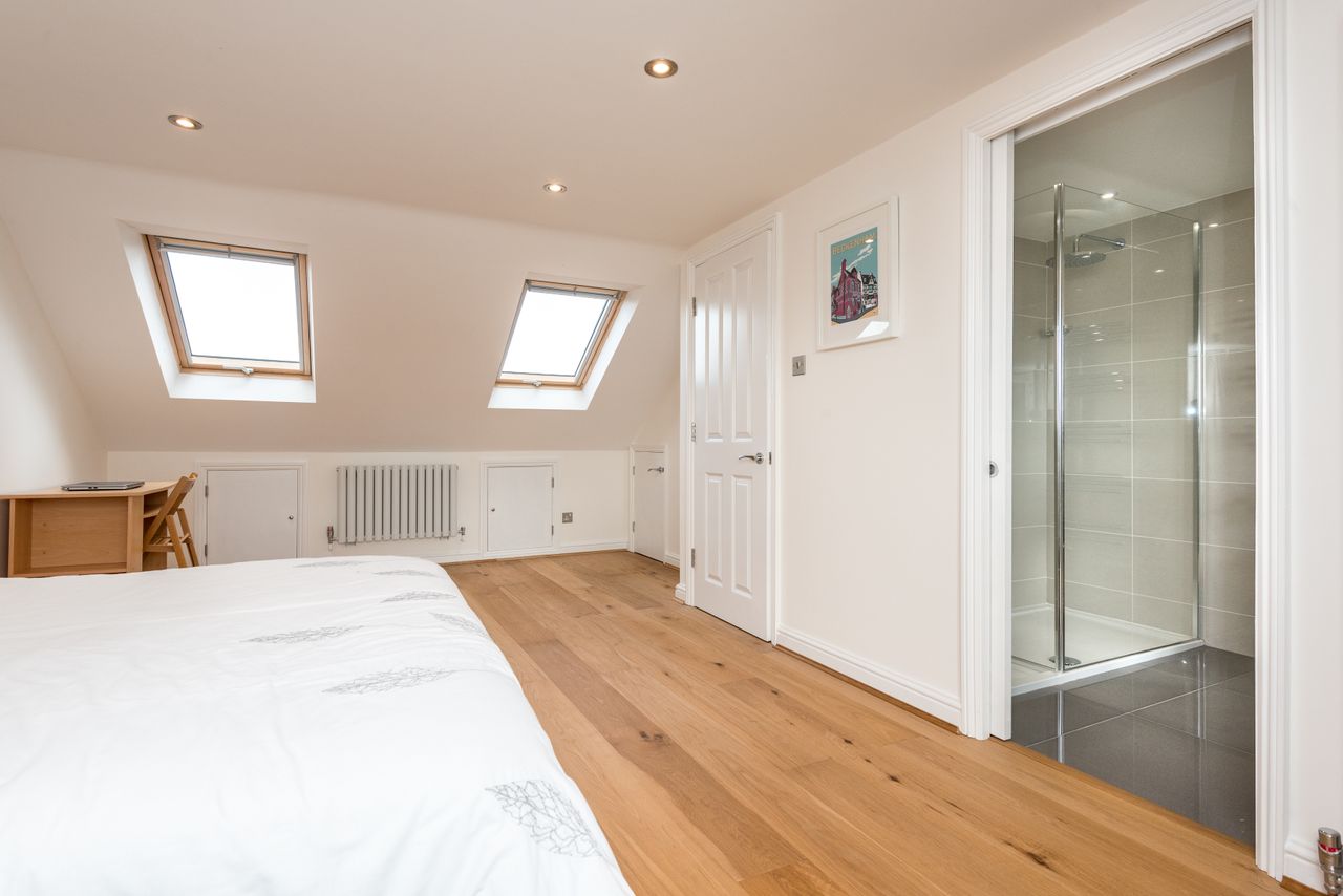 Econoloft loft conversion with sliding doors to bathroom