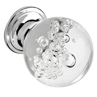 A clear glass door knob with bubbles visible inside.