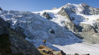 A man hiking the Walker's Haute Route in the Swiss Alps