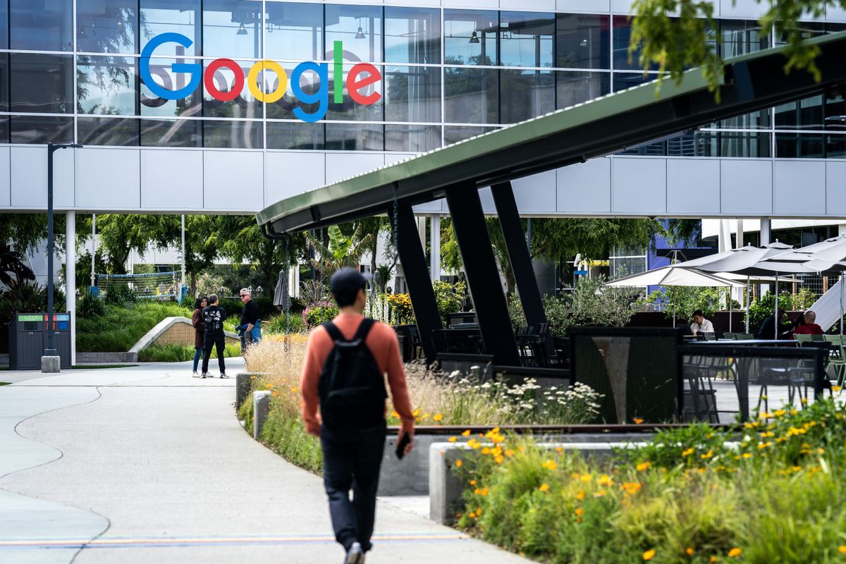 Somebody walking on a path heading towards Google&#039;s Mountain View campus