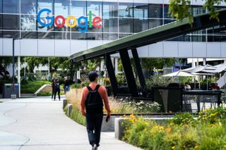 Somebody walking on a path heading towards Google's Mountain View campus