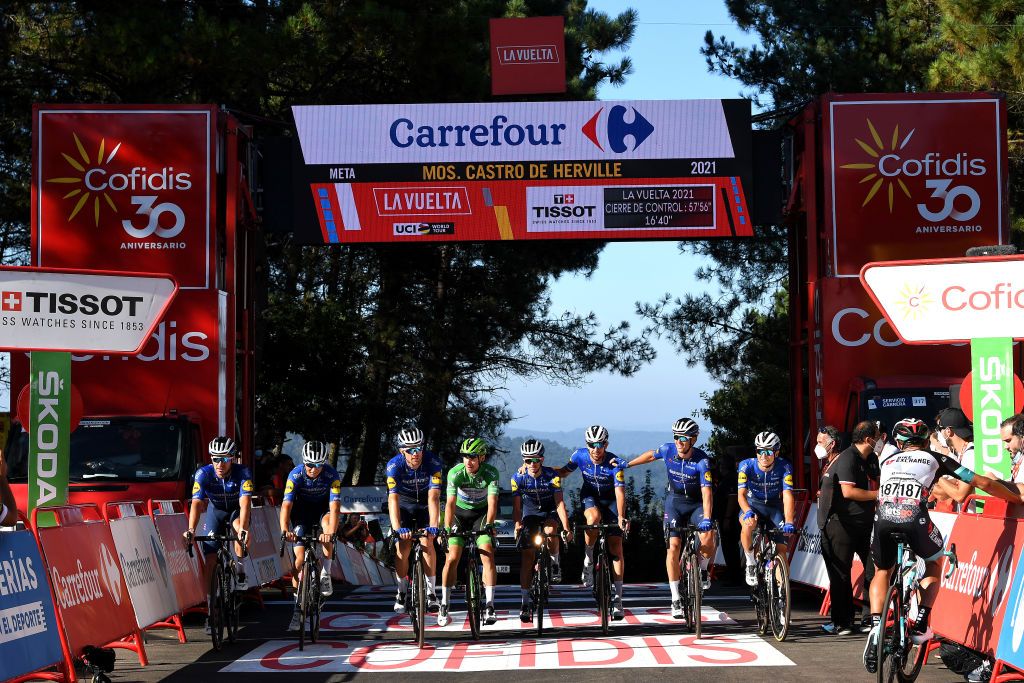 MOS SPAIN SEPTEMBER 04 Andrea Bagioli of Italy Josef Cerny of Czech Republic Fabio Jakobsen of Netherlands green points jersey James Knox of United Kingdom Florian Senechal of France Zdenek Stybar of Czech Republic Bert Van Lerberghe of Belgium Mauri Vansevenant of Belgium and Team Deceuninck QuickStep and Robert Stannard of Australia and Team BikeExchange celebrate cross the finishing line during the 76th Tour of Spain 2021 Stage 20 a 2022km km stage from Sanxenxo to Mos Alto Castro de Herville 502m lavuelta LaVuelta21 on September 04 2021 in Mos Spain Photo by Tim de WaeleGetty Images