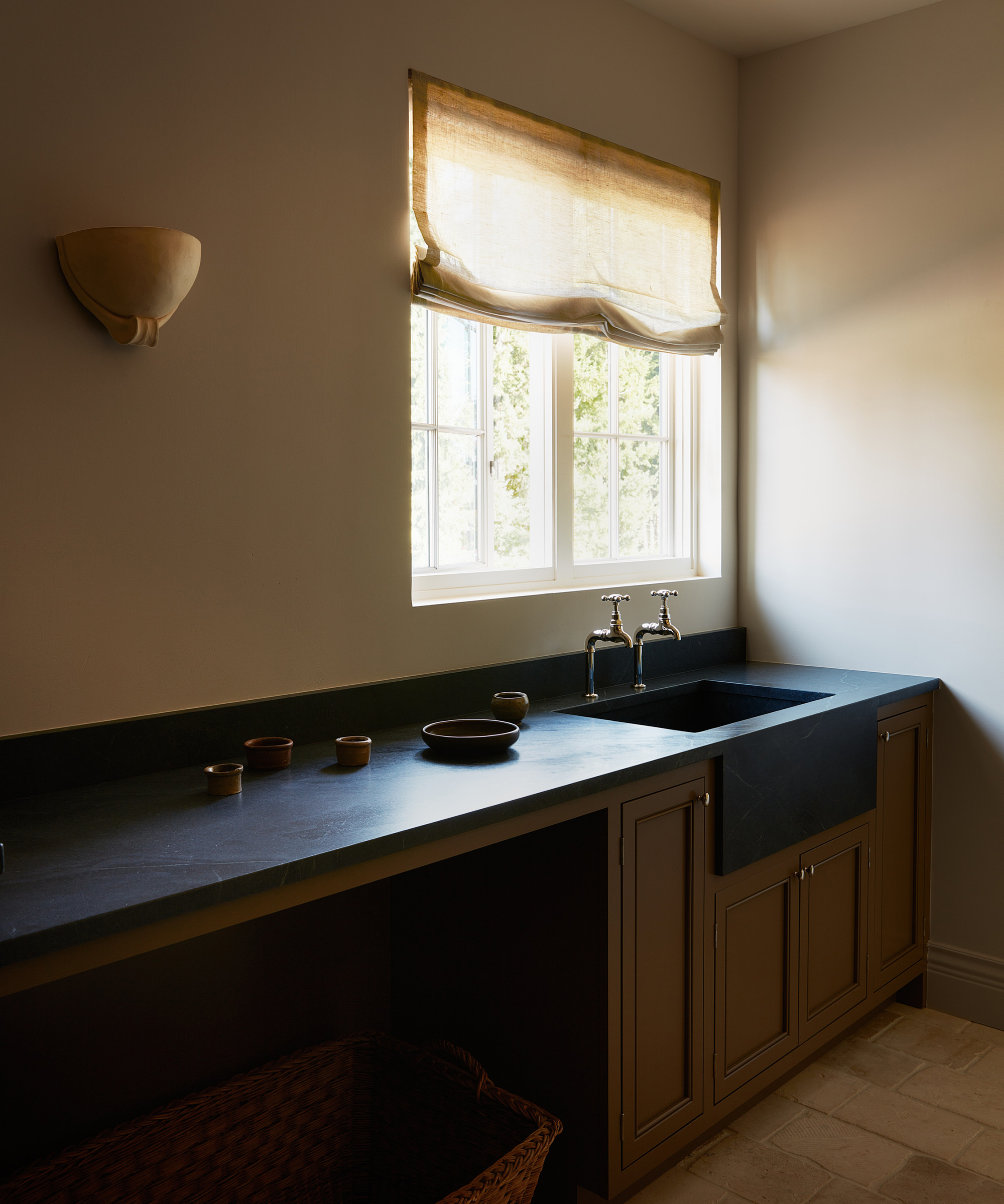 minimalist utility room with silver plated taps above the basin