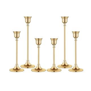 A set of six gold candlestick holders