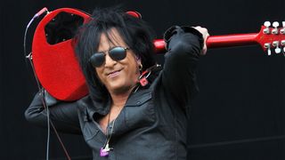 Steve Stevens performs live on stage with Billy Idol during Day 3 of the Download Festival at Donington Park on June 14, 2015 in Castle Donington, England. 