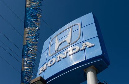 The Honda logo at a dealership