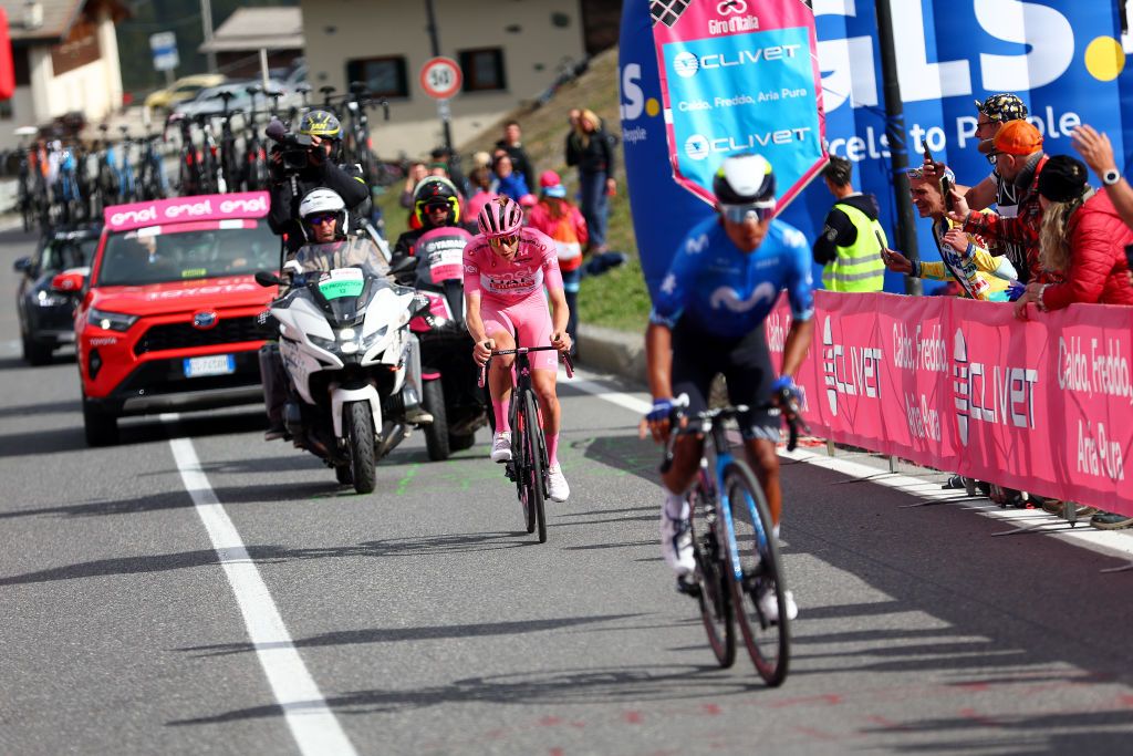 LIVIGNO MOTTOLINO ITALY MAY 19 LR Tadej Pogacar of Slovenia and UAE Team Emirates Pink Leader Jersey and Nairo Quintana of Colombia and Movistar Team compete in the breakaway climbing the Mottolino 2387m while fans cheer during the 107th Giro dItalia 2024 Stage 15 a 222km stage from Manerba del Garda to Livigno Mottolino 2387m UCIWT on May 19 2024 in Livigno Mottolino Italy Photo by Luca Bettini PoolGetty Images