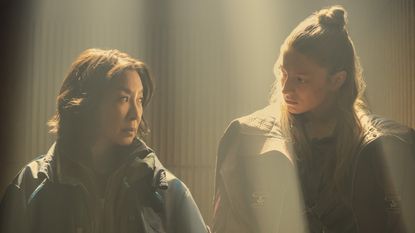 Michelle Yeoh and Hunter Schaeffer looking at each other in Blade Runner 2099