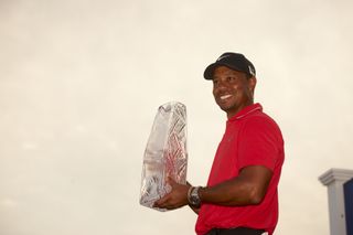 Tiger Woods with the Players Championship trophy in 2013