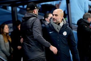 Manchester City manager Pep Guardiola, right, and Liverpool boss Jurgen Klopp are locked in a Premier League title battle