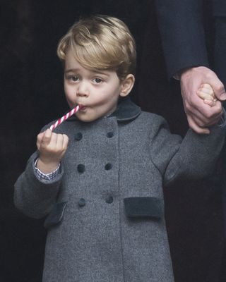 Prince George tucking into a candy cane