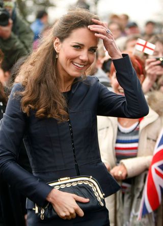 Kate Middleton speaking to the public and showing off her engagement ring
