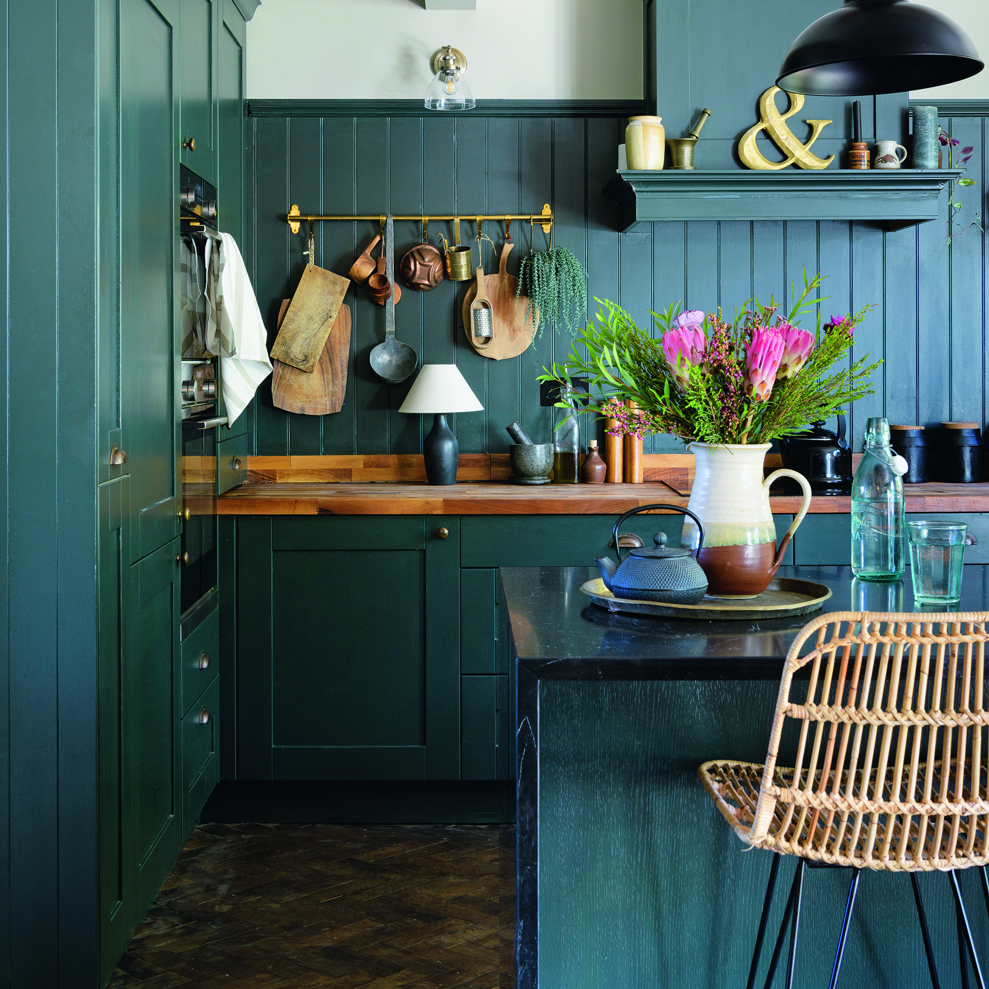 Navy kitchen with matching navy wall panelling