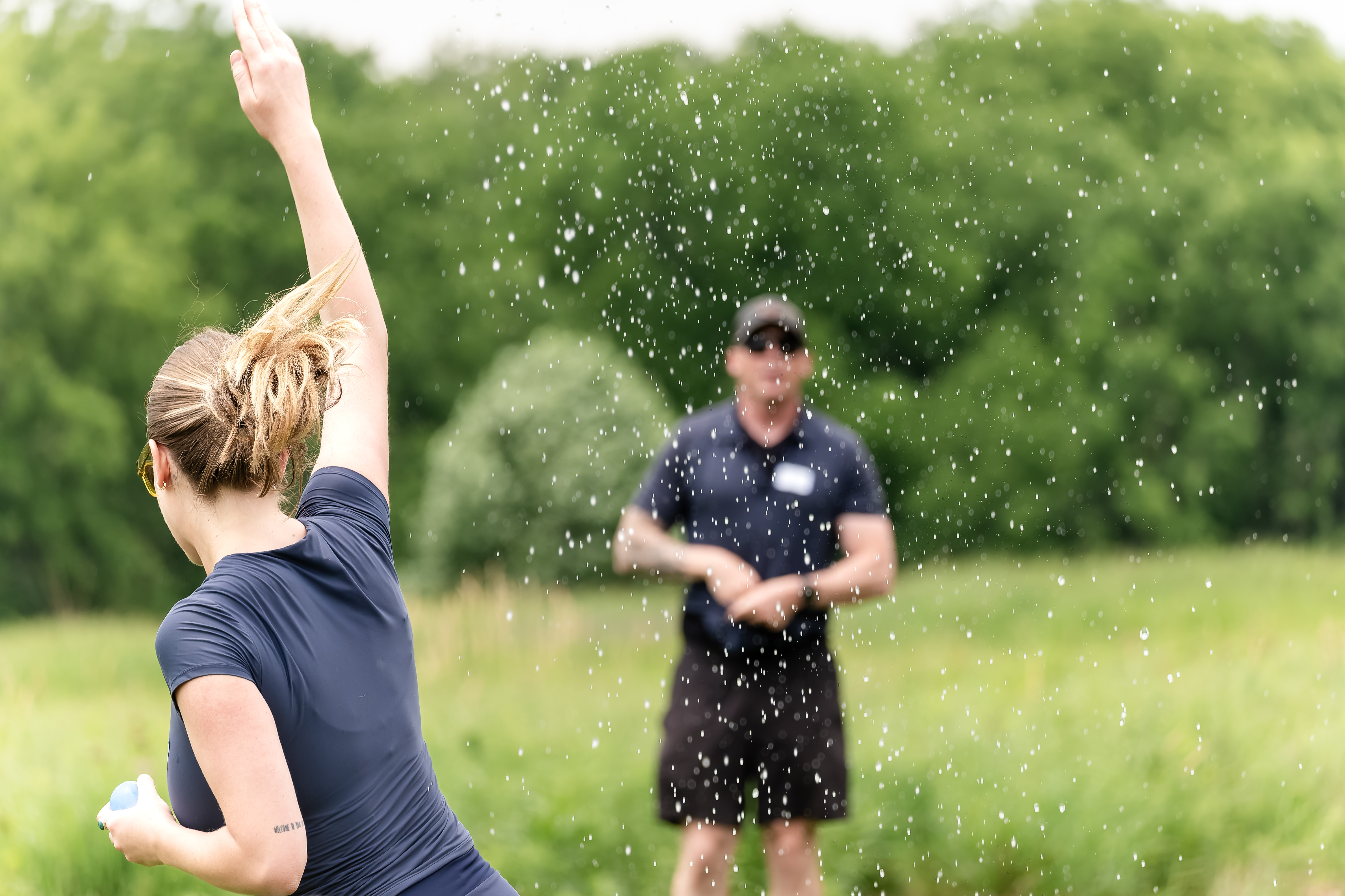 One of the author's relatives throwing a water balloon at a family reunion.