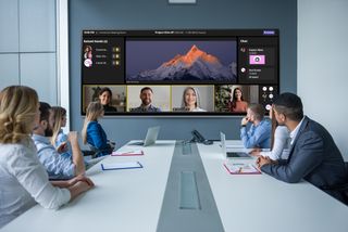 The new MAXHUB ultra-wide screen used in a conference room with remote participants.