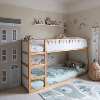 Kids room with wooden bunk beds, pear shape storage basket, rug, carpet, wall stickers