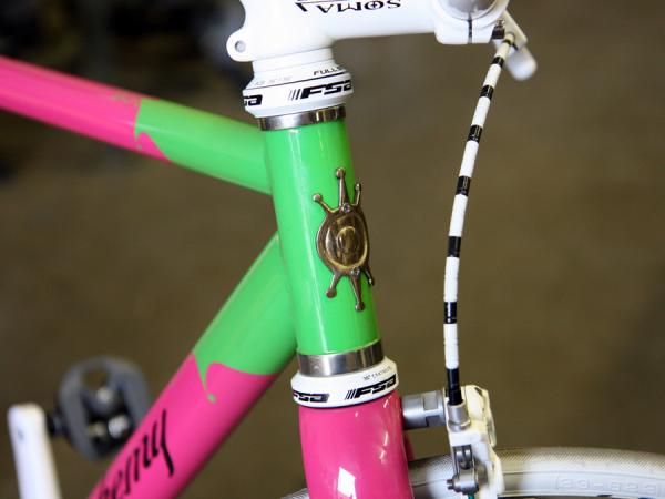 Polished stainless steel reinforcement rings adorn the front end of this Alchemy fixie.