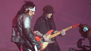 Nikki Sixx and Mick Mars of Mötley Crüe perform onstage during The Stadium Tour at Nationals Park on June 22, 2022 in Washington, DC