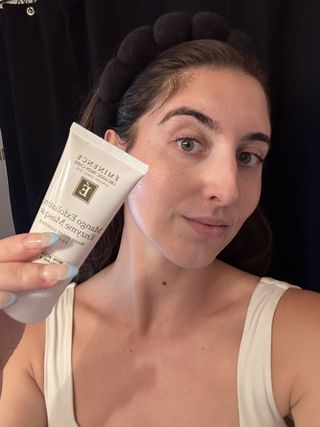 Marisa Petrarca, marie claire contributing beauty freelancer holding up Eminence Organic Skin Care Mango Exfoliating Enzyme Masque