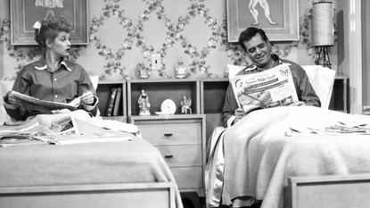 Lucille Ball and Desi Arnaz sleeping in separate beds on the I Love Lucy show