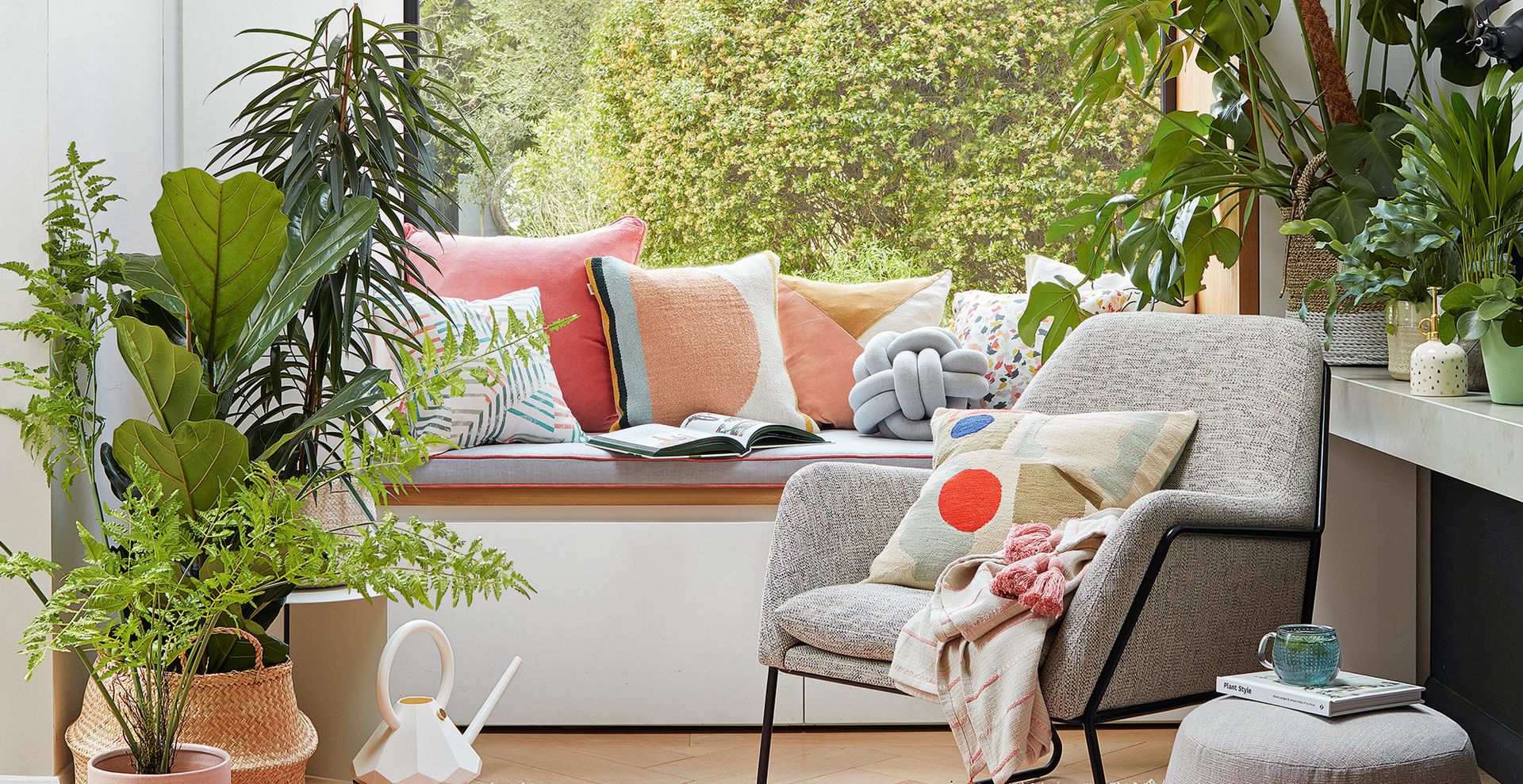living room window with window seat surrounded by greenery to show how to cool down a room without ac