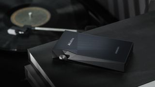 Astell & Kern A&Ultima in front of a record player