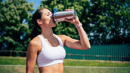 Best protein powder for women: A woman drinking a protein shake