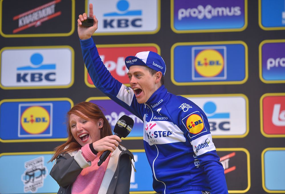Niki Terpstra celebrates on the podium after winning Tour of Flanders