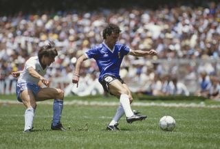 Argentina's Jose Luis Cuciuffo under pressure from England's Peter Beardsley at the 1986 World Cup.