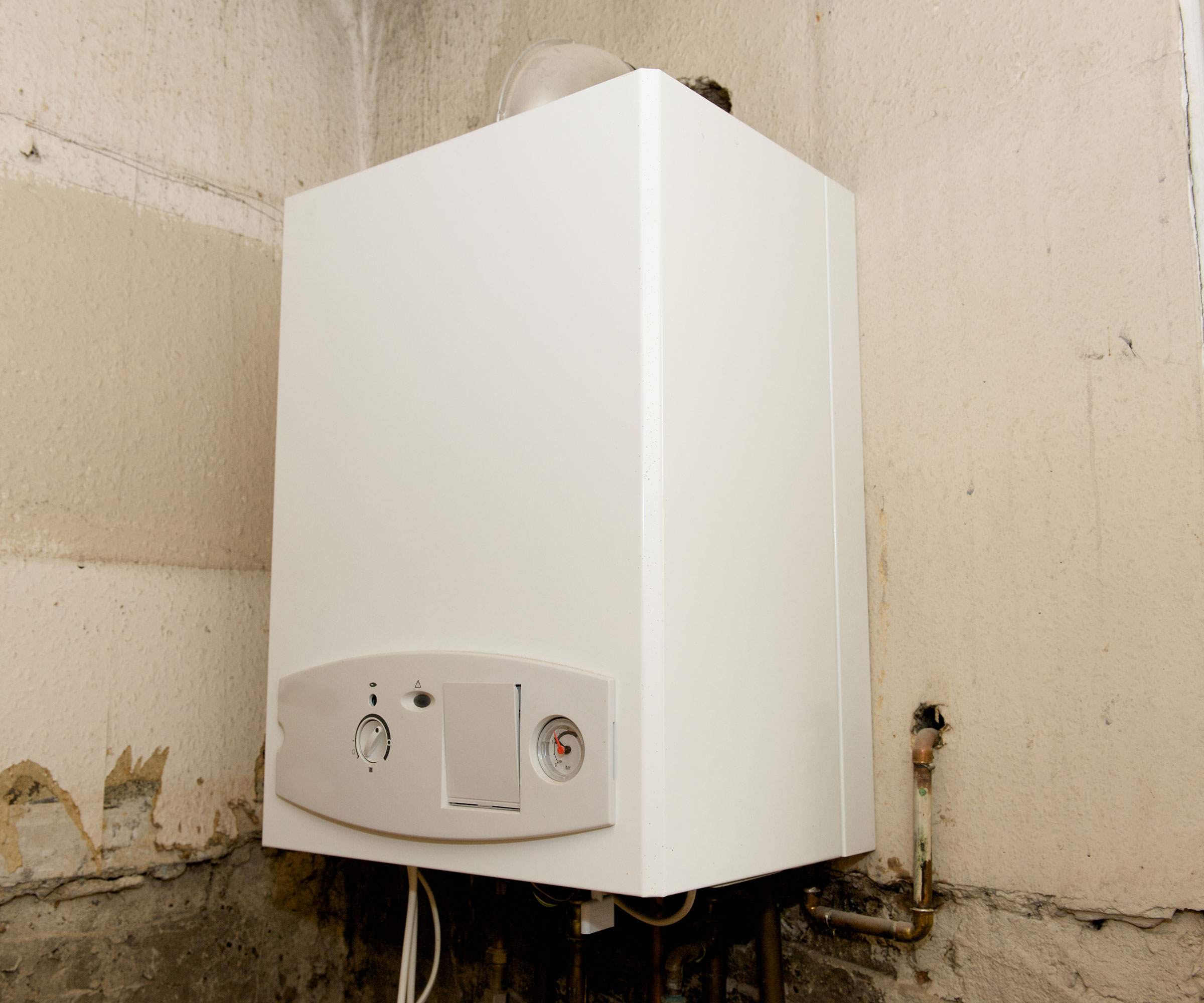 old gas boiler on wall