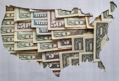 outline of U.S. map made of different denominations of dollar bills
