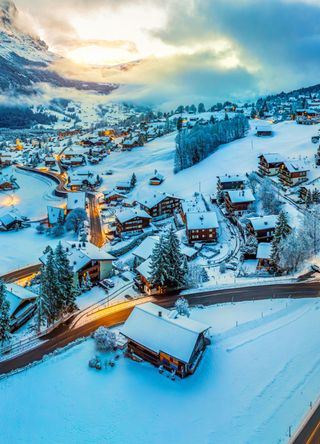 Panorama of Grindelwald at twilight in winter, Switzerland